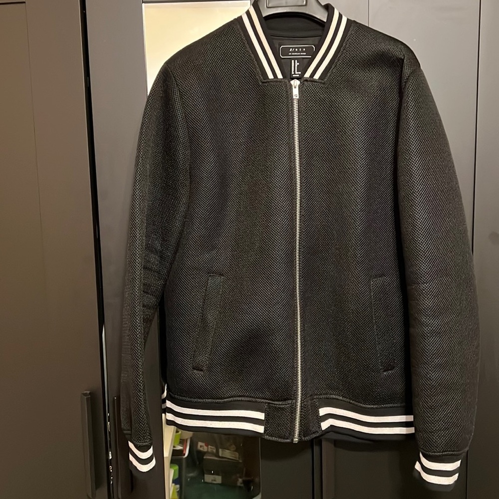 Men’s extra large black and white forever 21 bomber jacket, fits like a large